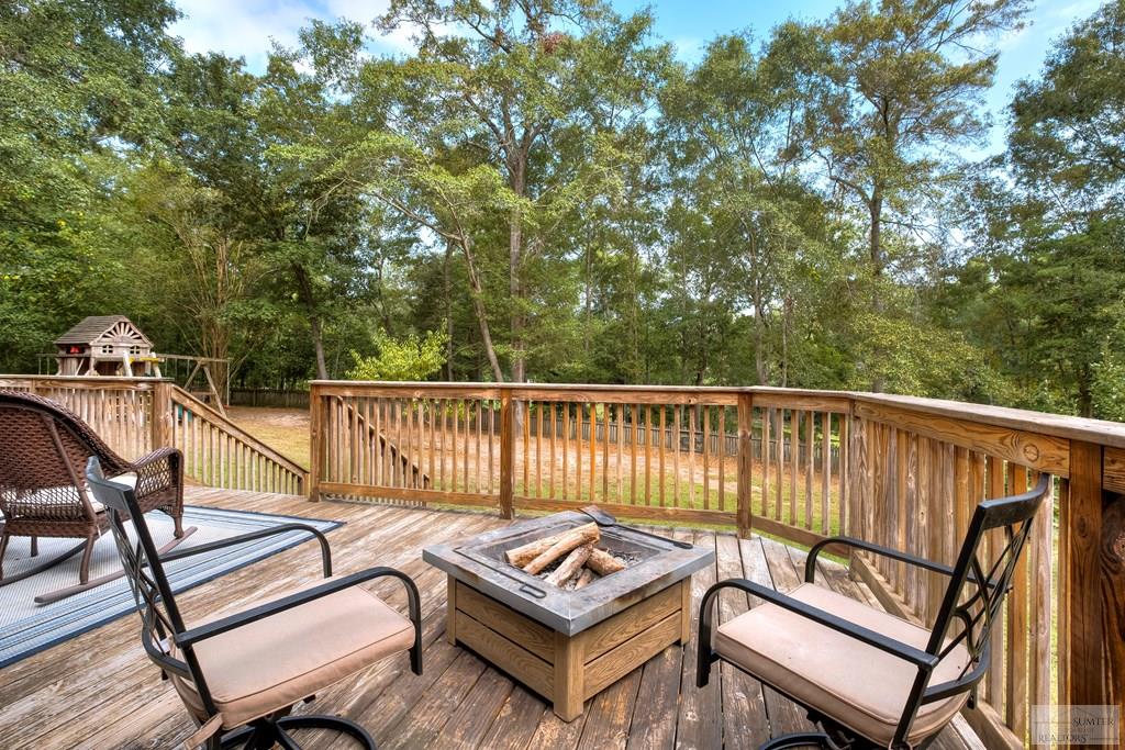 Deck overlooking backyard and golf course